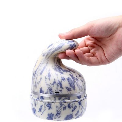 Instrument de massage de la tête intelligent pour le massage électrique du cuir chevelu et du cou 10X10X9 cm