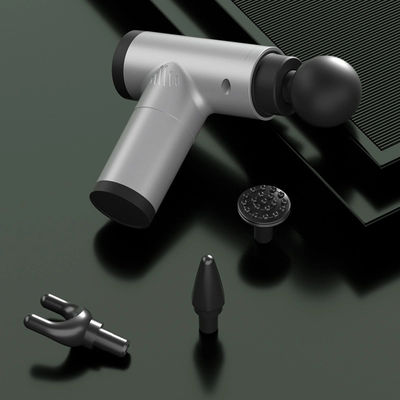 Un pistolet de massage à vibration à 4 têtes pratique pour la relaxation musculaire et la performance sportive
