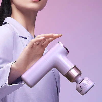 Un mini pistolet à fascia chauffé portable Votre secret pour le massage et la relaxation des tissus profonds